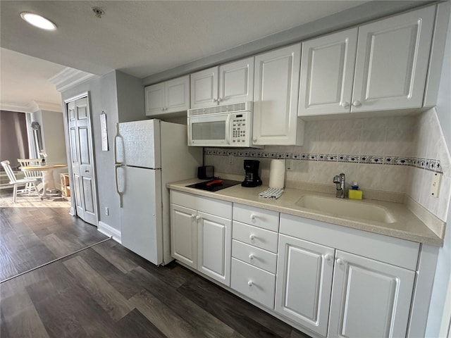 2700 N Atlantic Ave Unit 1003, Daytona Beach, FL 32118 - kitchen featuring white appliances, a sink, white cabinetry, light countertops, and recessed lighting