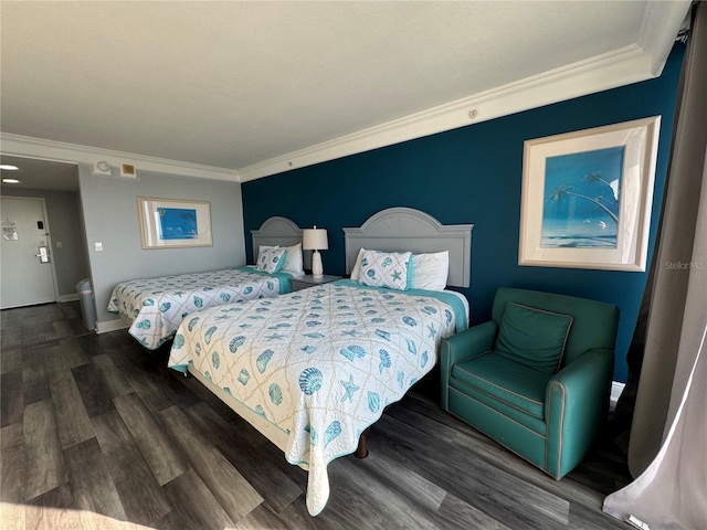 bedroom featuring ornamental molding and dark hardwood / wood-style floors