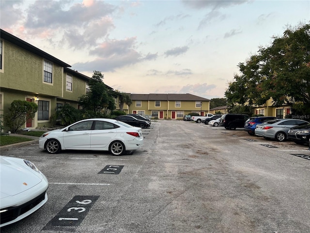 view of parking at dusk