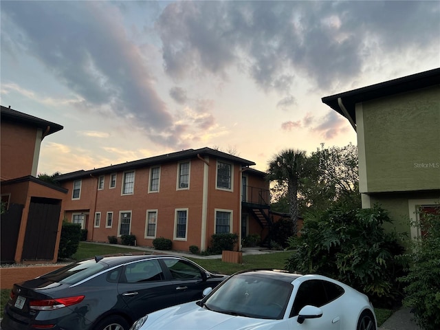 view of outdoor building at dusk