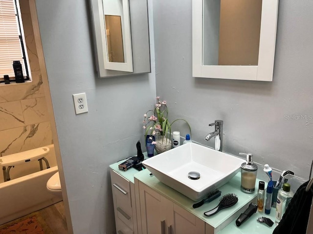 bathroom with toilet and vanity