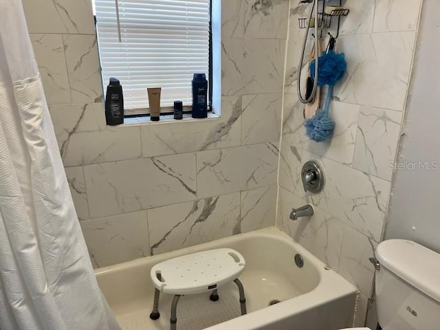 bathroom with toilet and shower / tub combo