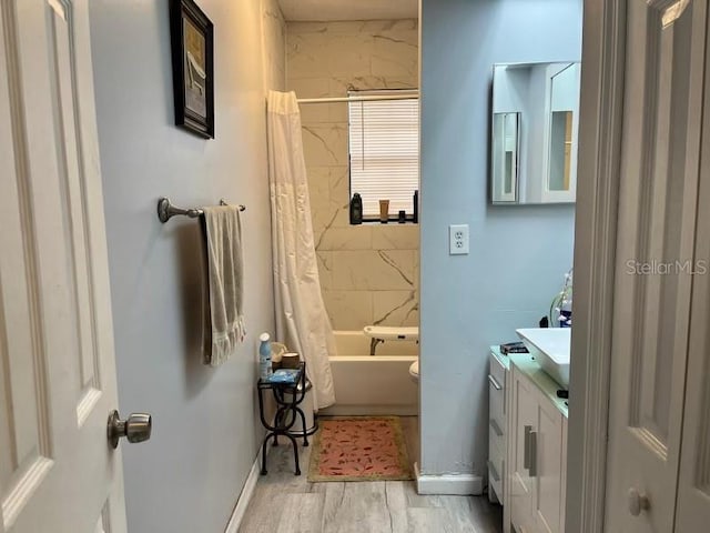 full bathroom with vanity, toilet, and shower / bathtub combination with curtain