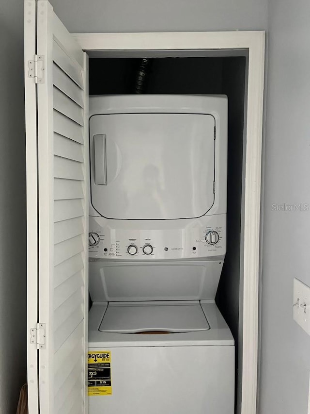 laundry room featuring stacked washer and dryer