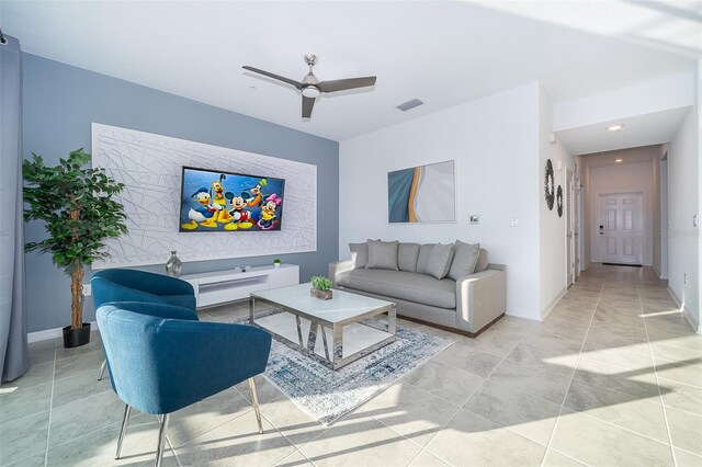 tiled living room featuring ceiling fan