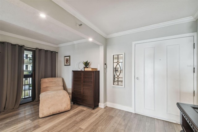 sitting room featuring light hardwood / wood-style floors and crown molding