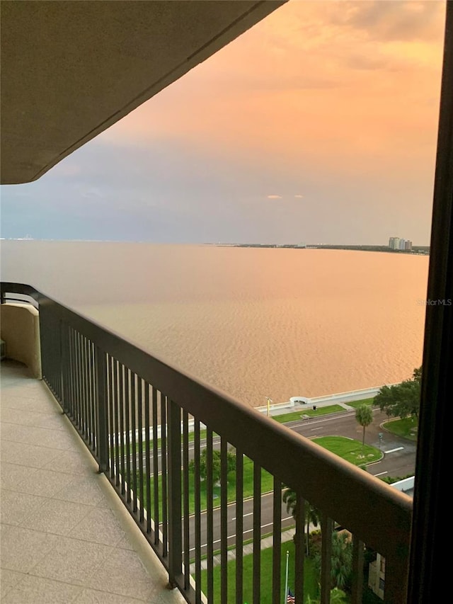 balcony at dusk with a water view