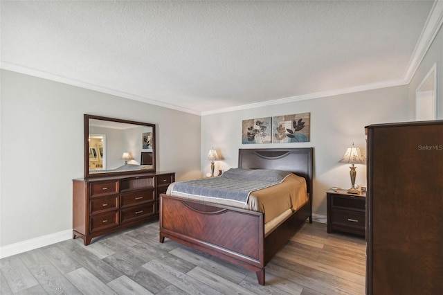 bedroom featuring crown molding, a textured ceiling, and light hardwood / wood-style flooring