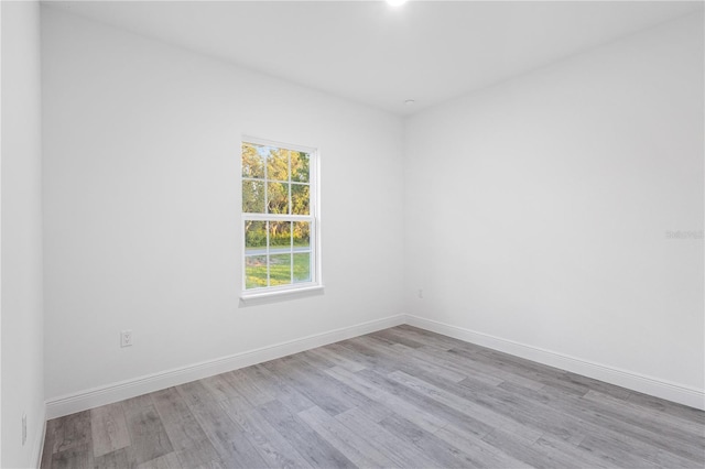 spare room with light wood-type flooring