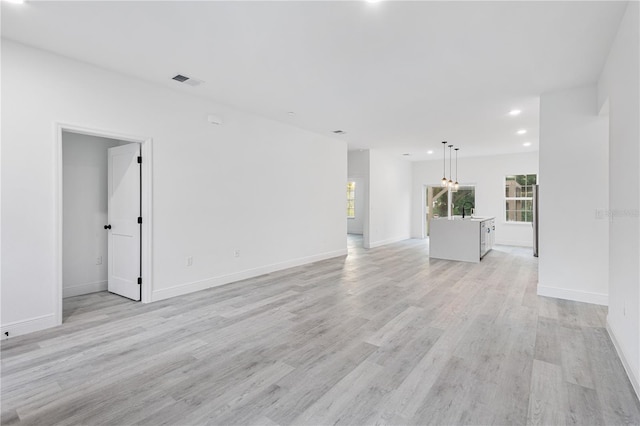 unfurnished room featuring light wood-type flooring