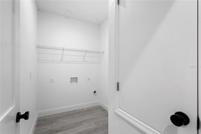 laundry room with light hardwood / wood-style floors, hookup for a washing machine, and hookup for an electric dryer