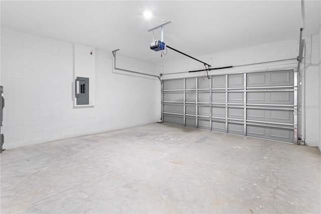 garage featuring electric panel and a garage door opener