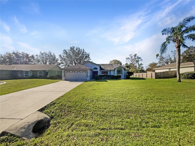 ranch-style home with a front yard and a garage