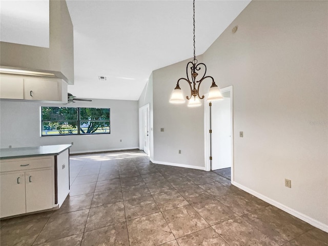 kitchen featuring high vaulted ceiling, pendant lighting, and ceiling fan with notable chandelier