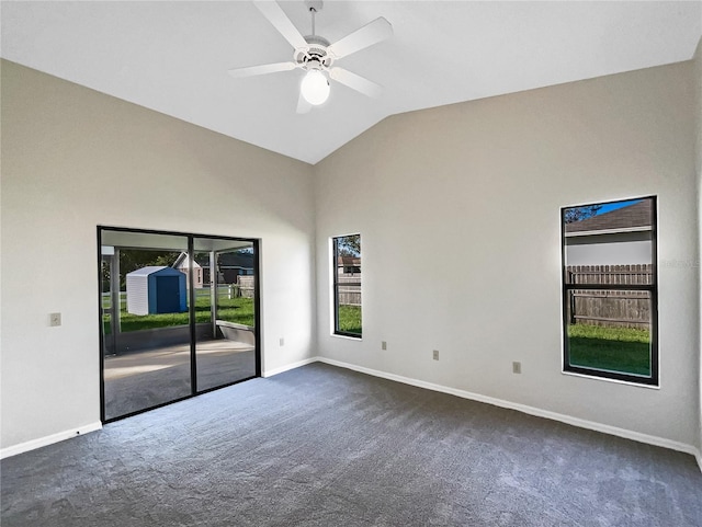 carpeted empty room with lofted ceiling and ceiling fan