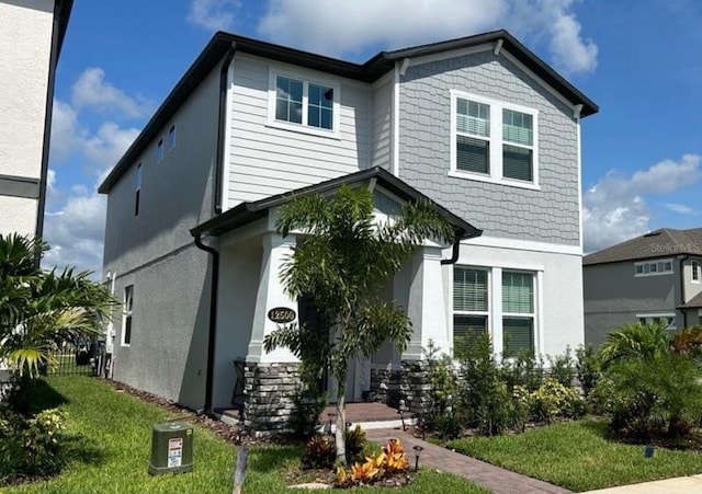 12500 Encore At Ovation Way, Winter Garden, FL 34787 - view of front of house with a front yard and stucco siding
