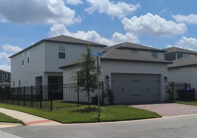 12500 Encore At Ovation Way, Winter Garden, FL 34787 - view of front of house with stucco siding, decorative driveway, a garage, and a shingled roof