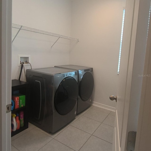 12500 Encore At Ovation Way, Winter Garden, FL 34787 - washroom featuring independent washer and dryer and light tile patterned flooring