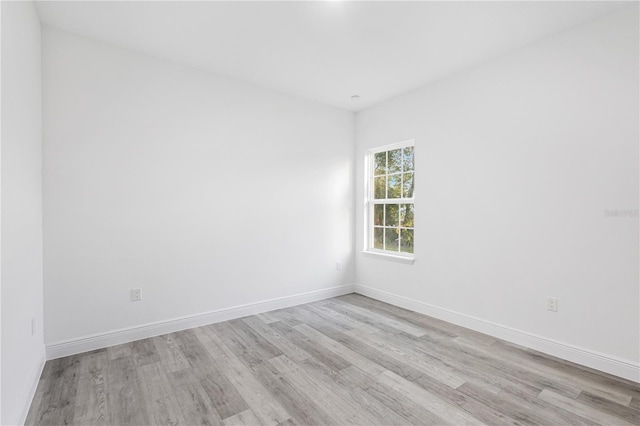 spare room with light wood-type flooring