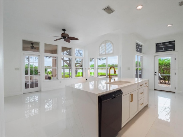 kitchen with sink, dishwasher, white cabinets, and a healthy amount of sunlight