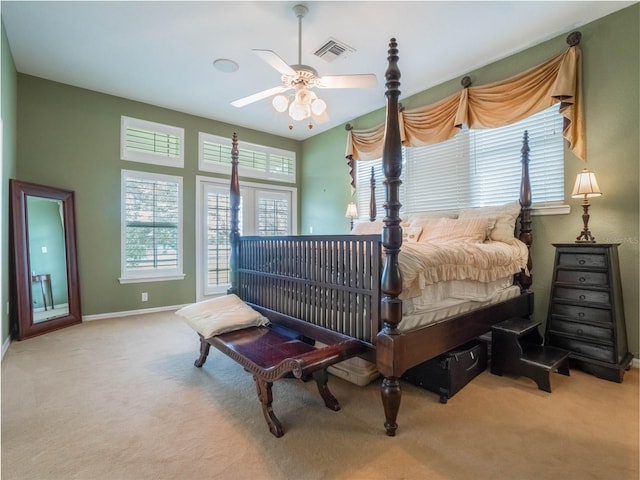 bedroom featuring ceiling fan and light carpet