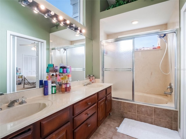 bathroom with vanity, enclosed tub / shower combo, ceiling fan, and tile patterned floors