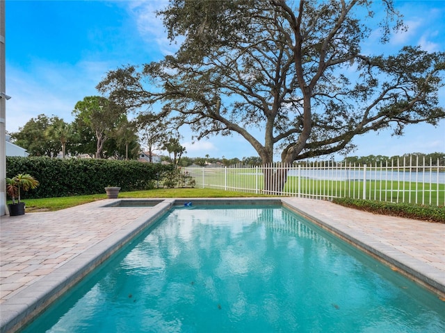 view of swimming pool with a patio