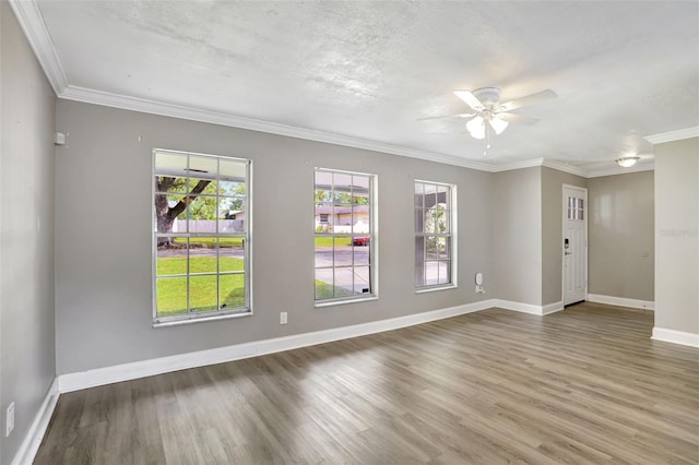 unfurnished room with hardwood / wood-style floors, crown molding, a textured ceiling, and ceiling fan