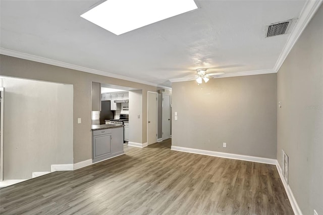 unfurnished living room featuring crown molding, light hardwood / wood-style floors, and ceiling fan