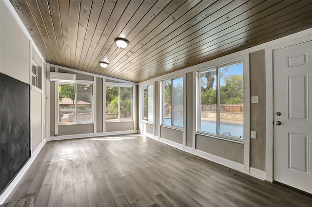 unfurnished sunroom with vaulted ceiling, wood ceiling, and a wall mounted air conditioner