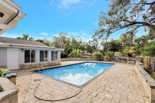 view of pool featuring a patio area