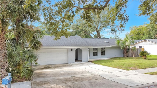 ranch-style house with a front yard and a garage