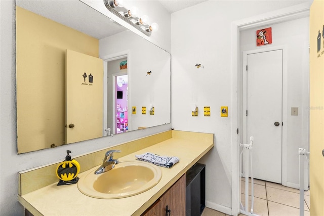 bathroom featuring tile patterned flooring and vanity