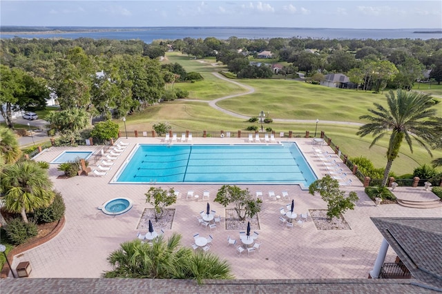 view of pool featuring a water view