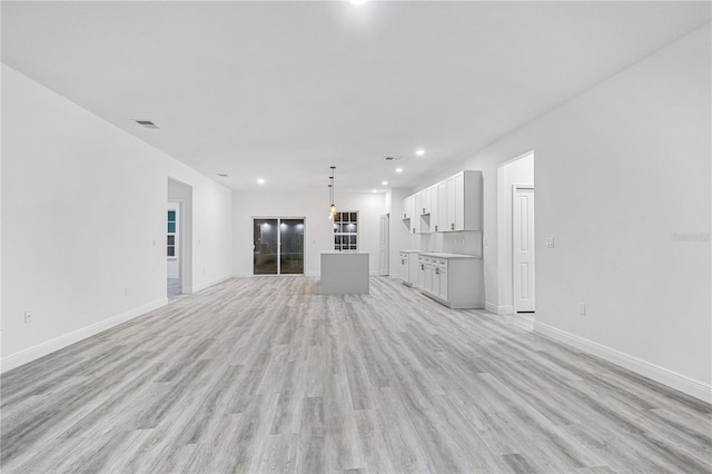 unfurnished living room with light hardwood / wood-style floors