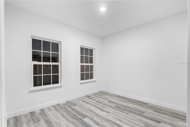 spare room featuring light hardwood / wood-style flooring