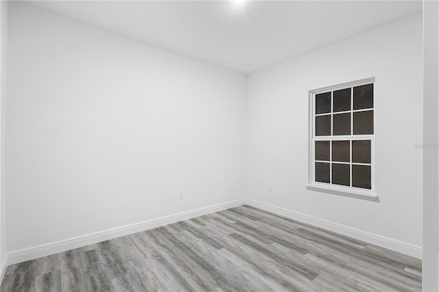 empty room with light hardwood / wood-style floors