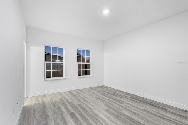 spare room with light hardwood / wood-style flooring