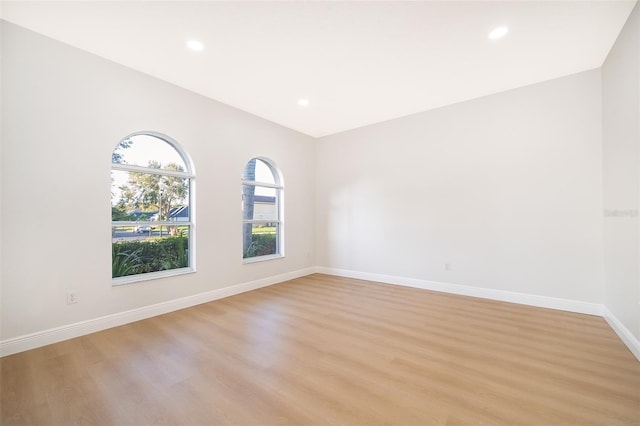 empty room with light hardwood / wood-style flooring