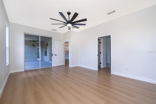 unfurnished room with light wood-type flooring and ceiling fan