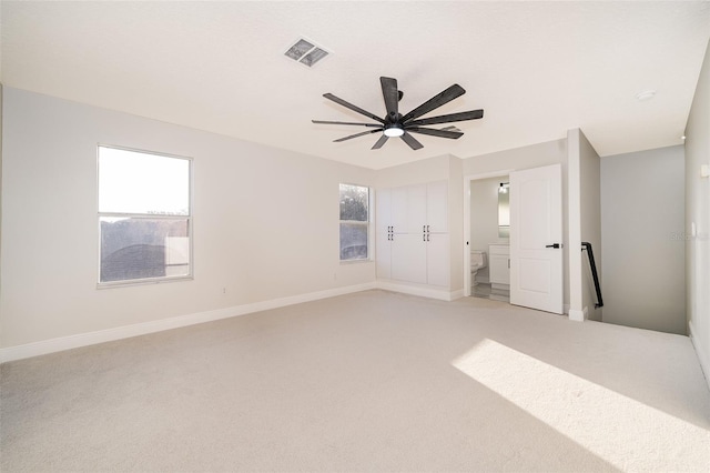 spare room featuring carpet flooring and ceiling fan