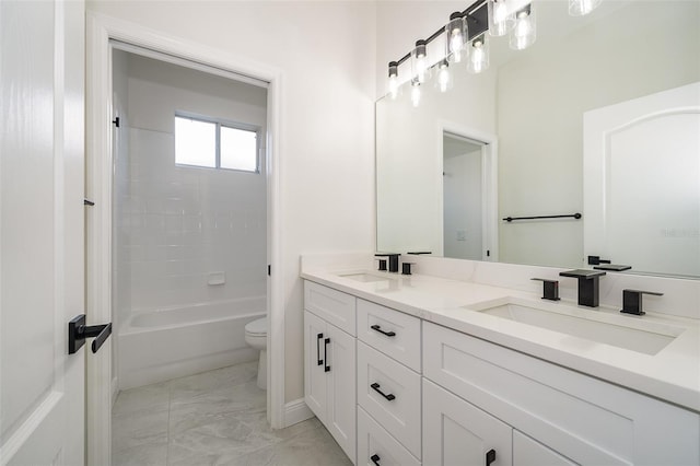 full bathroom featuring vanity, shower / washtub combination, and toilet