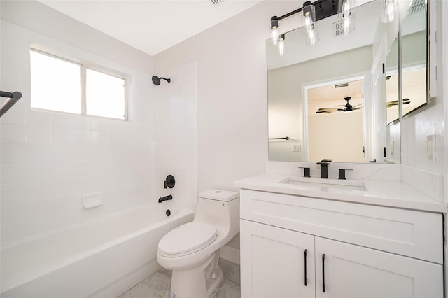 full bathroom with vanity, tiled shower / bath combo, toilet, and ceiling fan