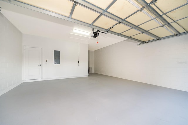 garage featuring electric panel and a garage door opener