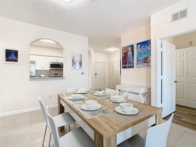 dining room featuring light tile patterned floors