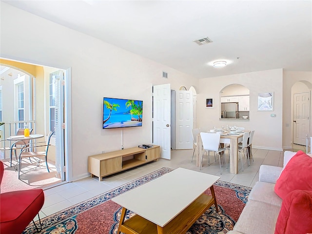 living room with light tile patterned floors