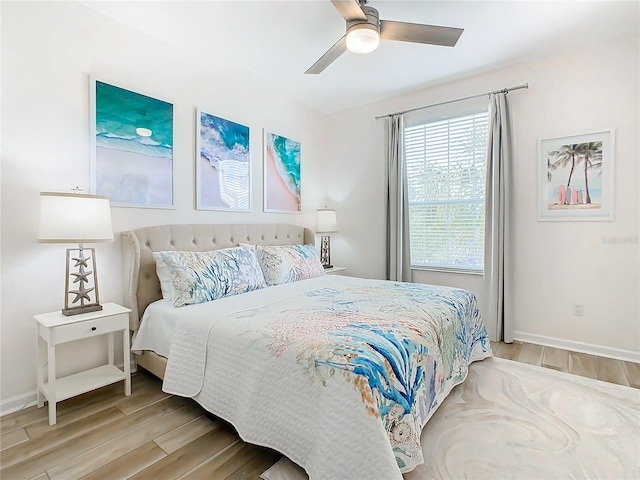 bedroom featuring light hardwood / wood-style flooring and ceiling fan