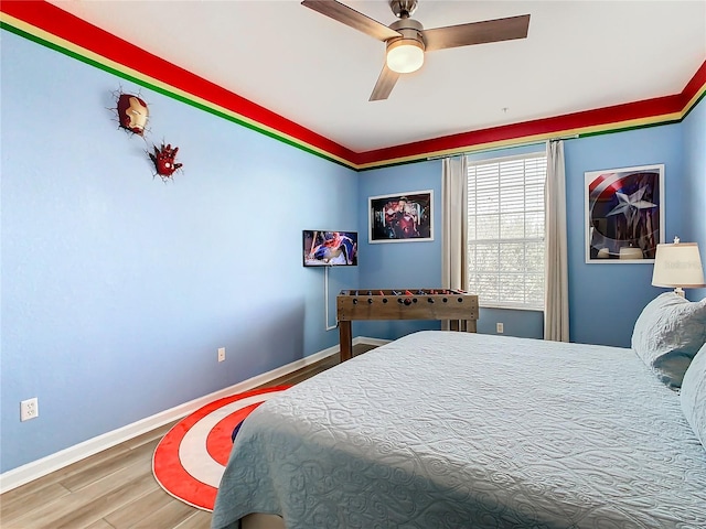 bedroom with hardwood / wood-style flooring and ceiling fan