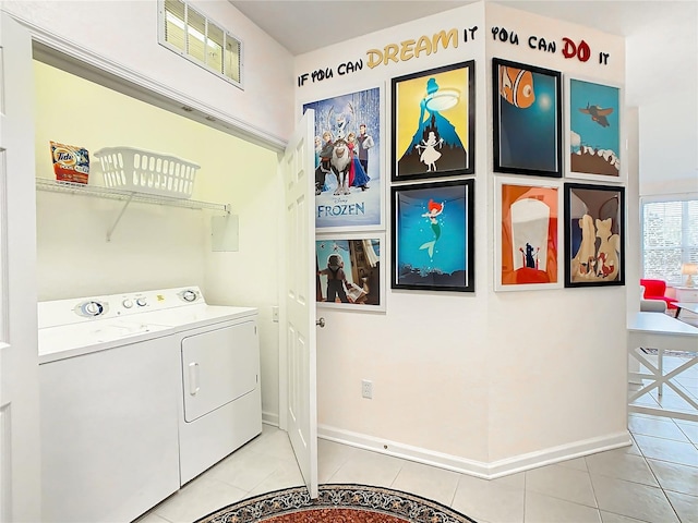 laundry room with tile patterned floors and washing machine and dryer