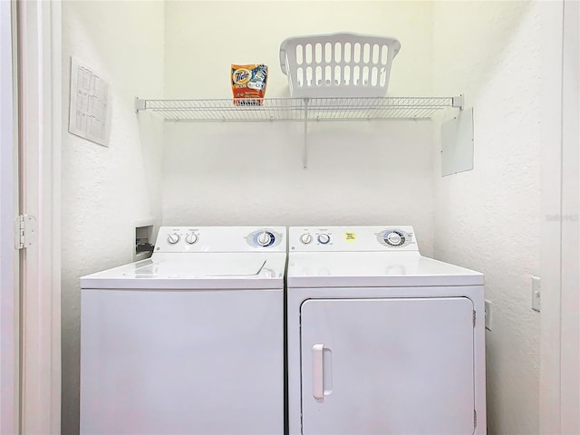 laundry area with separate washer and dryer